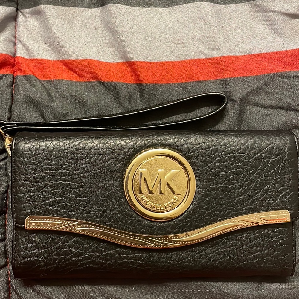 Black and Gold soft leather Michael Kors tri-fold wristlet.